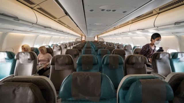 A plane with only a few passengers leaves for Bali, Indonesia in March 2020. Photo credit: iStock/Agustin Elejalde