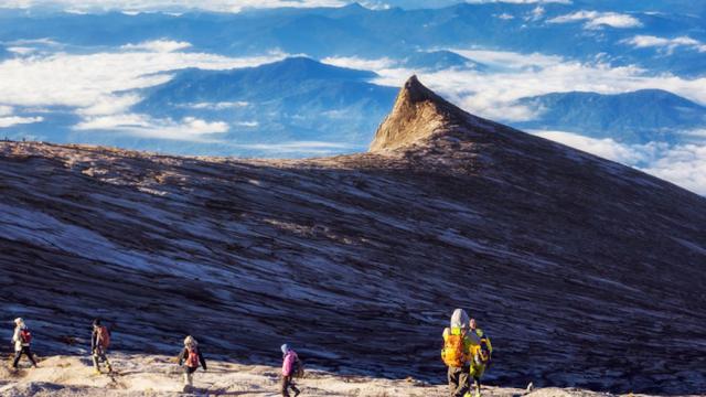 Tourists exploring Mount Kinabalu in Sabah.